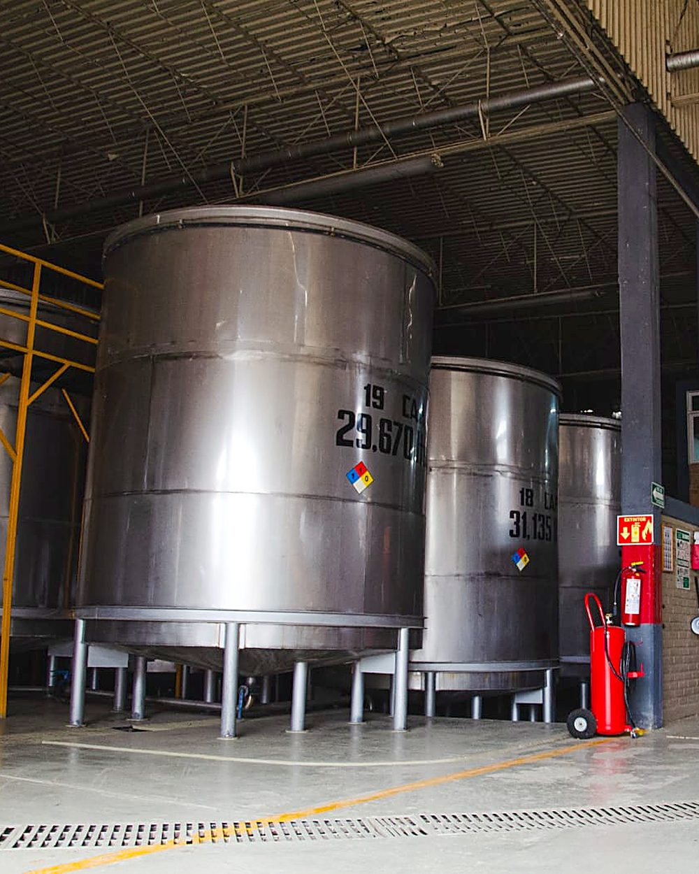 Stainless steel tanks on the distillery floor
