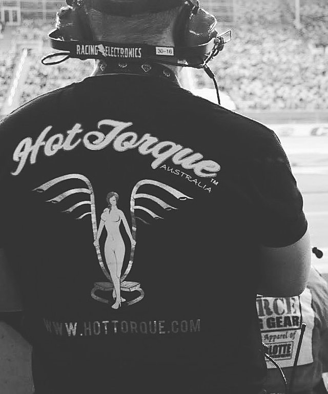 The back of a HotTorque Australia shirt, worn trackside with a racing headset